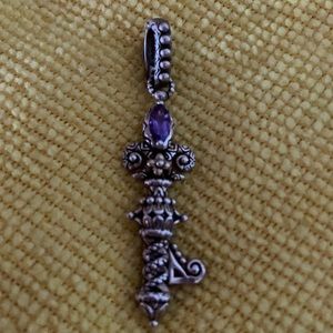 BARBARA BIXBY key pendant in sterling silver and 18 k gold with amethyst.